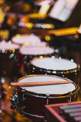 Close-up of drum set with drumsticks on snare for orchestra