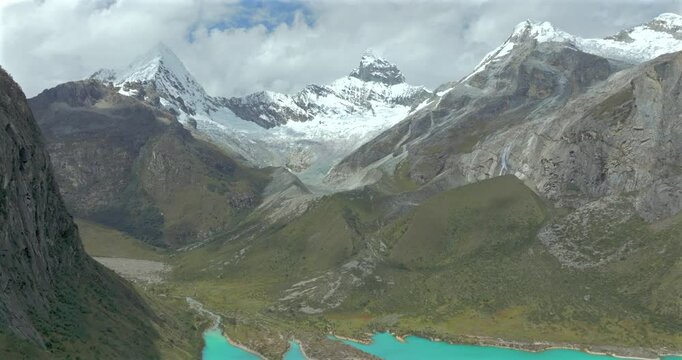 Aerial footage of majestic rugged Andean mountains under a blue sky