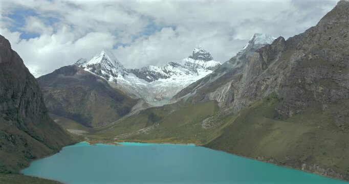 Turquoise waters of Paron lake surrounded by rugged Andean mountains