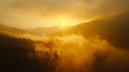 Naklejka premium Misty mountain range at dawn, invigorating sunrise casting golden hues, forest below, ethereal and tranquil atmosphere