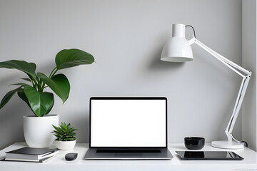 Modern work table with blank computer laptop and accessories in home office studio.