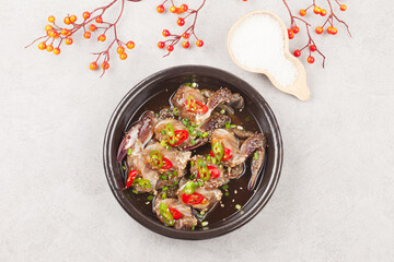  A food made by boiling ingredients such as onions and peppers, then pouring the cooled soy sauce over prepared crabs several times and allowing them to age.
