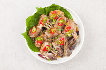  A food made by boiling ingredients such as onions and peppers, then pouring the cooled soy sauce over prepared crabs several times and allowing them to age.
