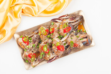  A food made by boiling ingredients such as onions and peppers, then pouring the cooled soy sauce over prepared crabs several times and allowing them to age.
