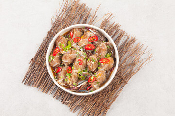  A food made by boiling ingredients such as onions and peppers, then pouring the cooled soy sauce over prepared crabs several times and allowing them to age.
