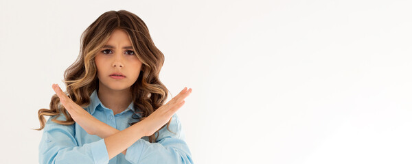 Young caucasian woman wearing blue shirt over white background Rejection expression crossing arms...