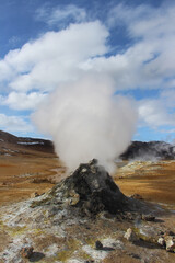 Geothermal spot of mud & steaming fumaroles emitting sulfuric gas