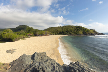 White sand Mawi beach, and scenic tropical coastline of Lombok island on a bright sunny day