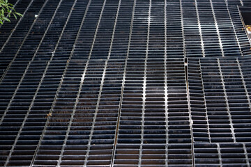 A black metal grate with a lot of holes