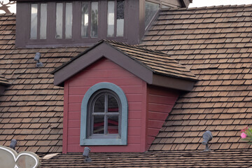garret house with wooden roof shingle.