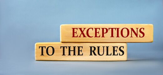 EXCEPYIONS TO THE RULES - words on wooden blocks on blue background