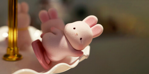 Small figurine in the shape of a rabbit, used as decoration, around the piece assembled for...