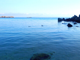 Obraz premium Beautiful sea view of the beach in Sardinia. Blue Mediterranean sea. Sea in the Morning. Island Sardinia in Italy.