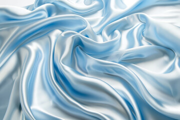 Obraz premium Elegant close-up of flowing white and blue satin fabric with intricate folds and luxurious texture.