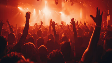 High-altitude shot of packed concert audience with vibrant lights