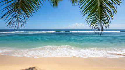 Obraz premium Golden sandy beach with turquoise ocean waves under clear blue sky, framed by palm tree leaves 