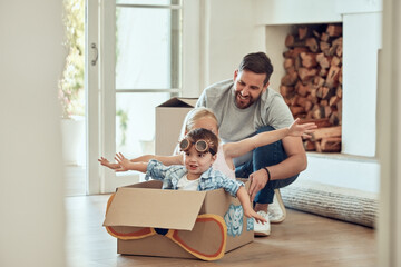 Dad, children and home with cardboard airplane for playing, happiness and bonding in new family house. Father, siblings and push box in living room for fun or energy, growth and development with kids