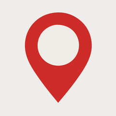 A red location pin icon. The pin is designed with a rounded top, resembling a location marker, and a pointed bottom, indicating direction. It is set against a white background.