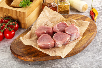Uncooked raw pork tenderloin medallions