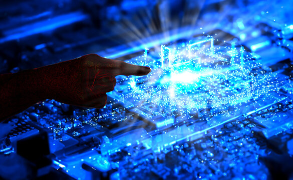 an alien hand pointing at a quantum computer