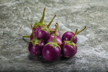 Raw small purple asian baby eggplant