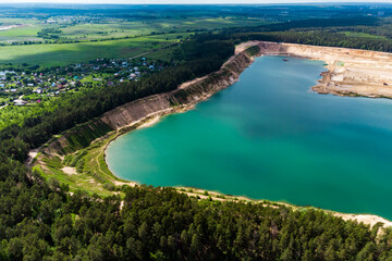 Aerial view of a flooded sand quarry in the countryside. Bolotsky quarry, Kaluga region