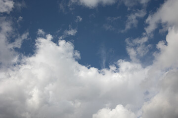 Blue sky. Beautiful Cumulus clouds flying across the sky,
