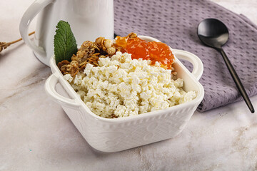 Curd with granola and orange jam