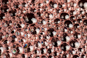 foam in a glass of pomegranate juice