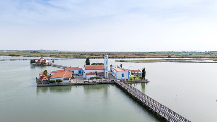 Aerial drone view od Agios Nikolaos Monastery on the Vistonida Lake at Porto Lagos, Greece