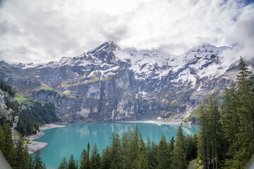 oeschinensee is the place where the tourist came to walk trek hike camp and picnic .there is many beautiful and amazing view point to take photo , kandersteg Switzerland  