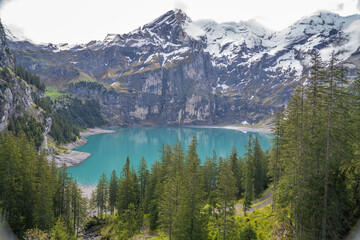 Obraz premium oeschinensee is the place where the tourist came to walk trek hike camp and picnic .there is many beautiful and amazing view point to take photo , kandersteg Switzerland 