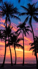 Obraz premium A serene tropical beach at sunset with palm trees silhouetted against a colorful sky, perfect for a vacation atmosphere