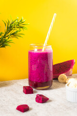 dragon fruit smoothie with yellow background. Perfect for recipe, article, or any cooking contents.