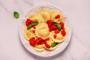 Ravioli with tomato sauce and basil