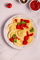 Ravioli with tomato sauce and basil