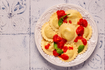 Ravioli with tomato sauce and basil