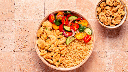 Bowl of quinoa with vegan soy meat and vegetables.