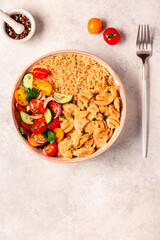 Bowl of quinoa with vegan soy meat and vegetables.