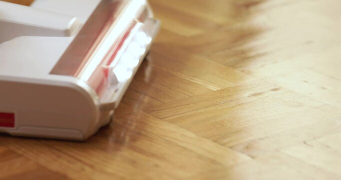 cordless vacuum, vacuum cleaner cleaning the floor at home.