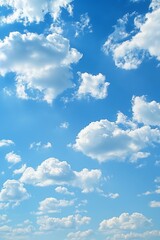 Fototapeta premium Peaceful fluffy clouds drift in a bright blue sky, creating a scenic view of heaven and nature.