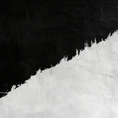 Fototapeta premium Abstract black and white texture with rough, diagonal division; black paint contrasts against white, creating a stark, minimalist composition with visible brushstrokes and texture.