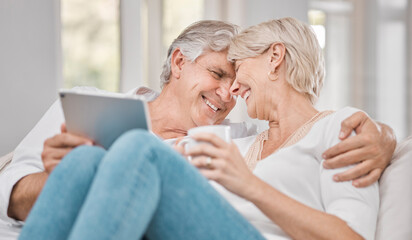 Senior couple, tablet and love on sofa for relax, retirement and connection or online in home. Technology, elderly man and woman on couch for communication, streaming and watch movies in apartment