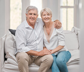 Portrait, hug and senior couple on sofa for retirement with love relationship, support and happy smile in home. Embrace, mature woman and man on couch for peace, relax and bonding together for trust