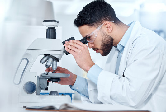 Man, microscope and examine research in lab, biochemist and innovation healthcare study with virus sample. Investigation, cure development and disease analysis or breakthrough, medical and equipment