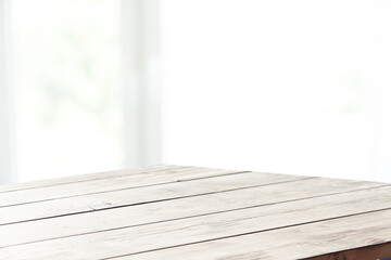 Wooden board and free space for decoration. Kitchen interier. Sunny natural light and window shade....