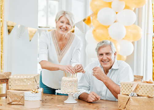 Senior couple, portrait and birthday cake in home to celebrate, prepare candles and express gratitude. Married people, woman and happy man with party for new age, growth or wife with dessert on table - Powered by Adobe