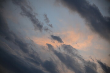 beautiful cloudy sunset creating pink and orange clouds.