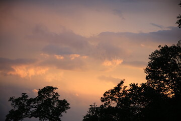 beautiful cloudy sunset creating pink and orange clouds.