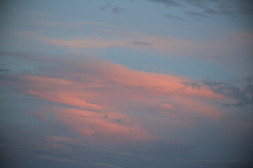 beautiful cloudy sunset creating pink and orange clouds.